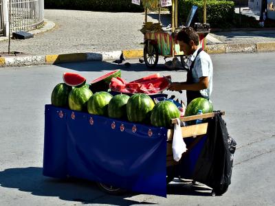 Offering slices of water melon for refreshment